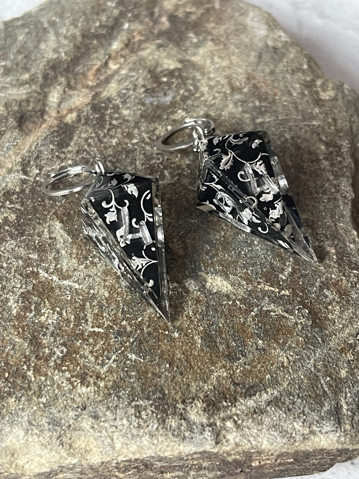Silvery Barbs D4 dice earrings