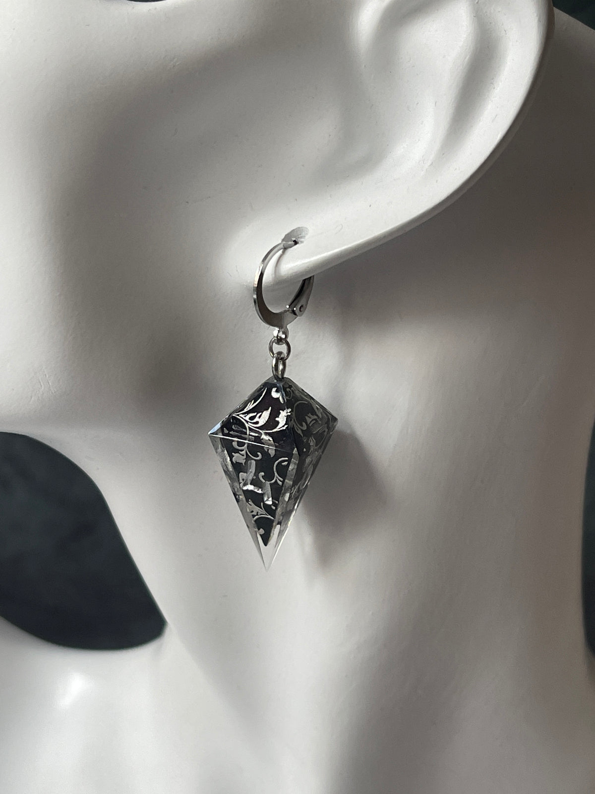Silvery Barbs D4 dice earrings