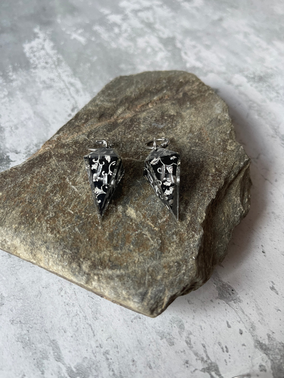Silvery Barbs D4 dice earrings